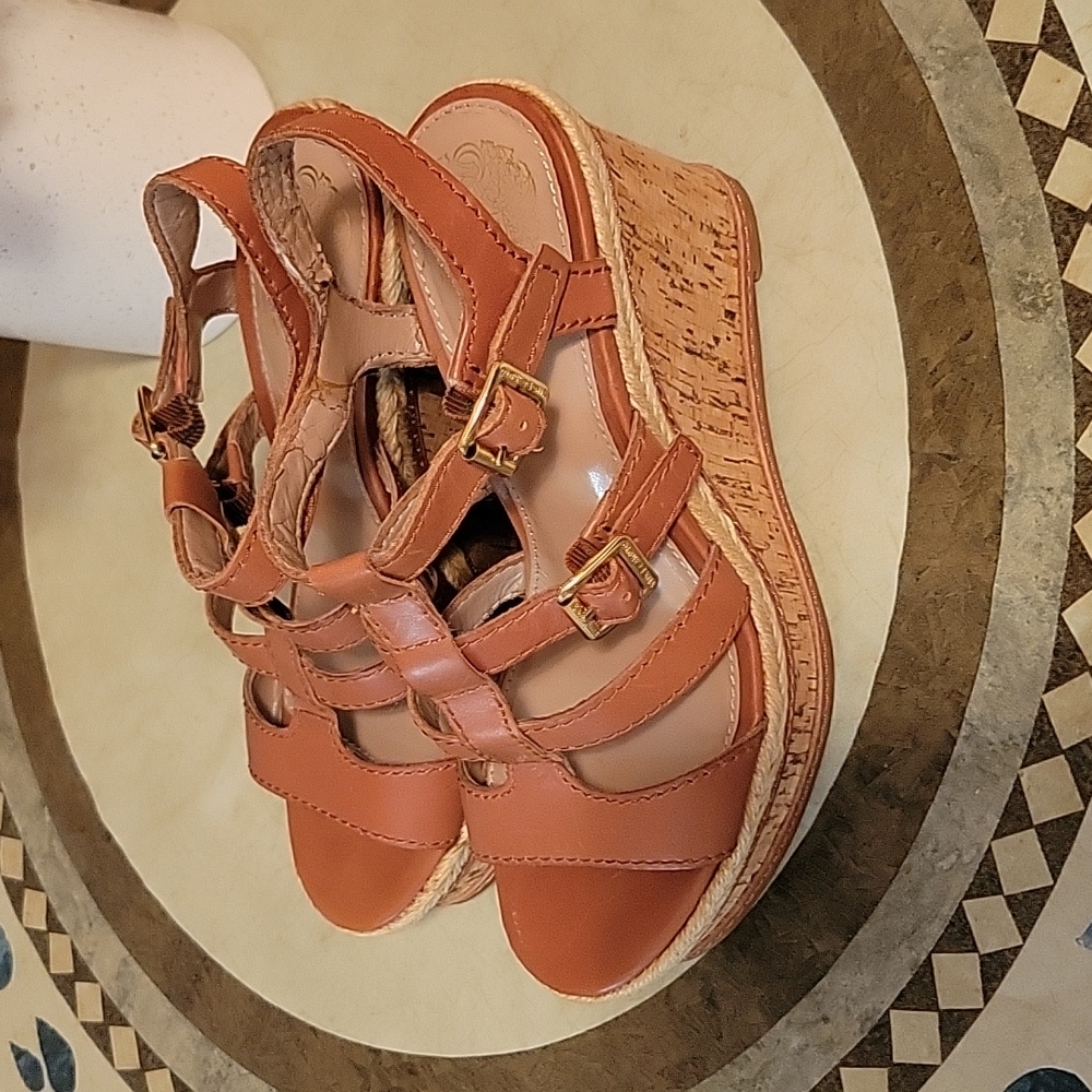 Women size 6 Tan wedge heel Sandal.
